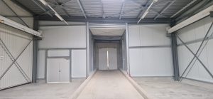 Errichtung einer Einhausung mit Verbindungsgang